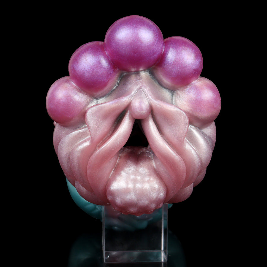 Novelty alien-style sex toy, purple and pink translucent bulb end with tentacle details