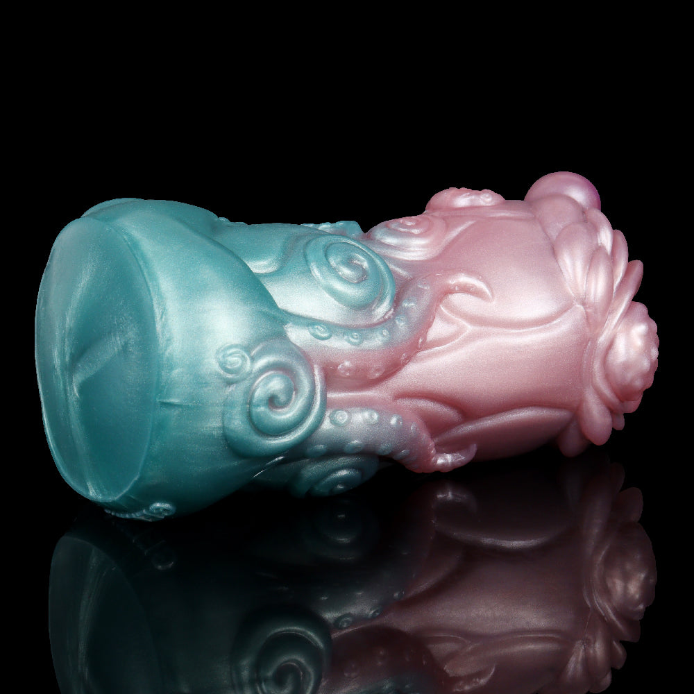 Celestial Tentacraze stroker side view, glossy teal and pink alien-monster shape