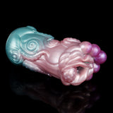 Celestial Tentacraze stroker angled view, pink center with teal highlights