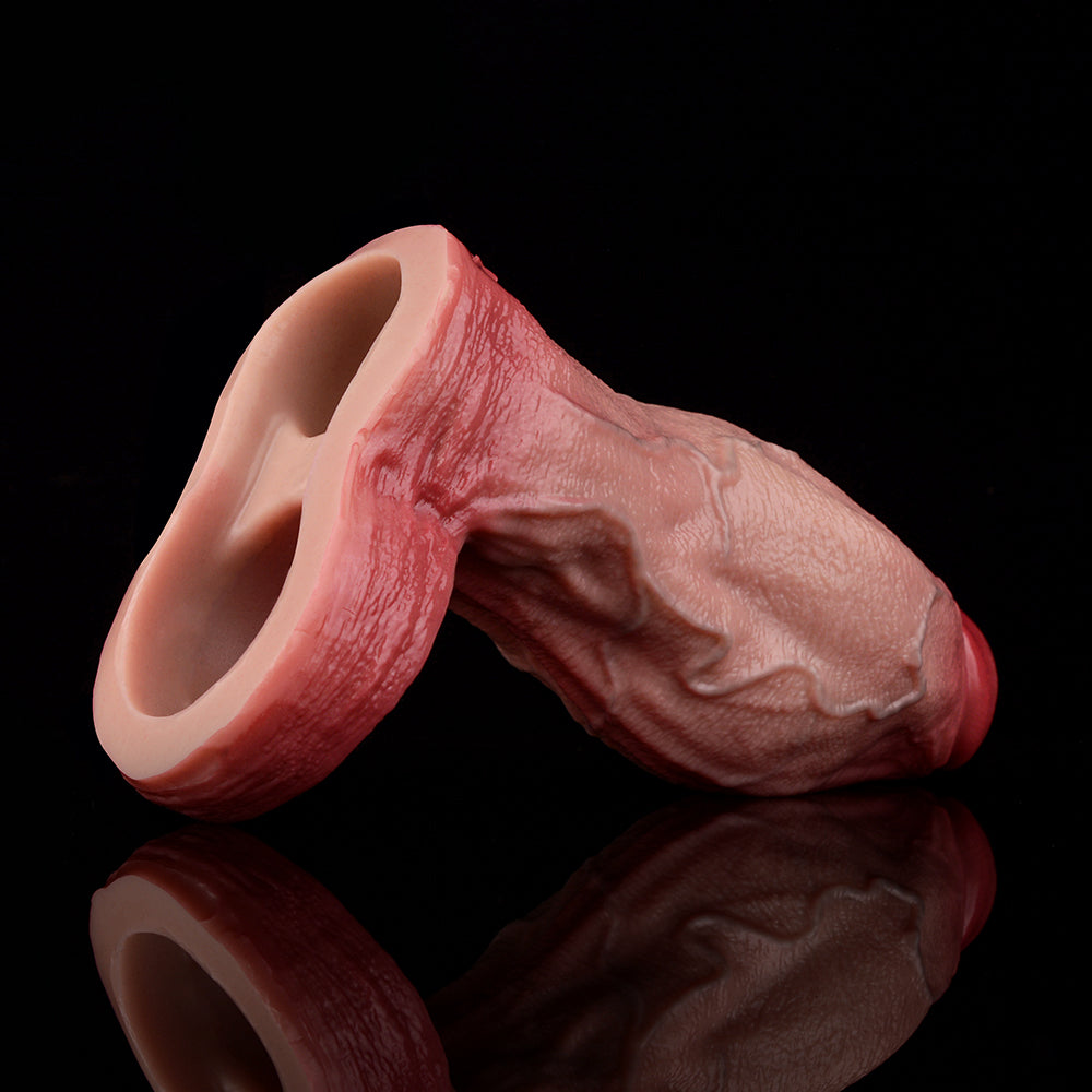 Pink realistic penis sleeve from underside, open tip and knot band detail