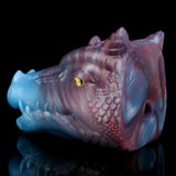 Blue/pink fantasy dragon one-hole masturbator, side profile with yellow eye