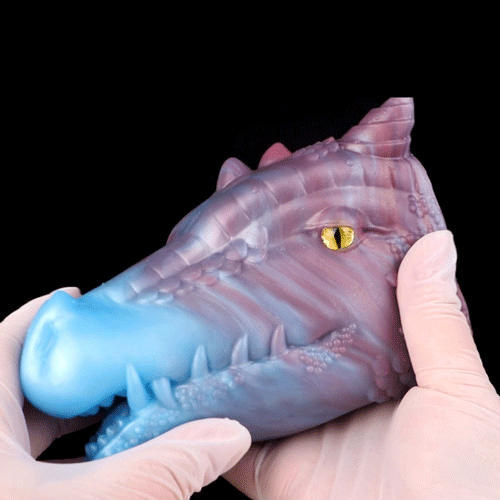 Translucent blue dragon masturbator with pink belly, yellow eye, and open jaws