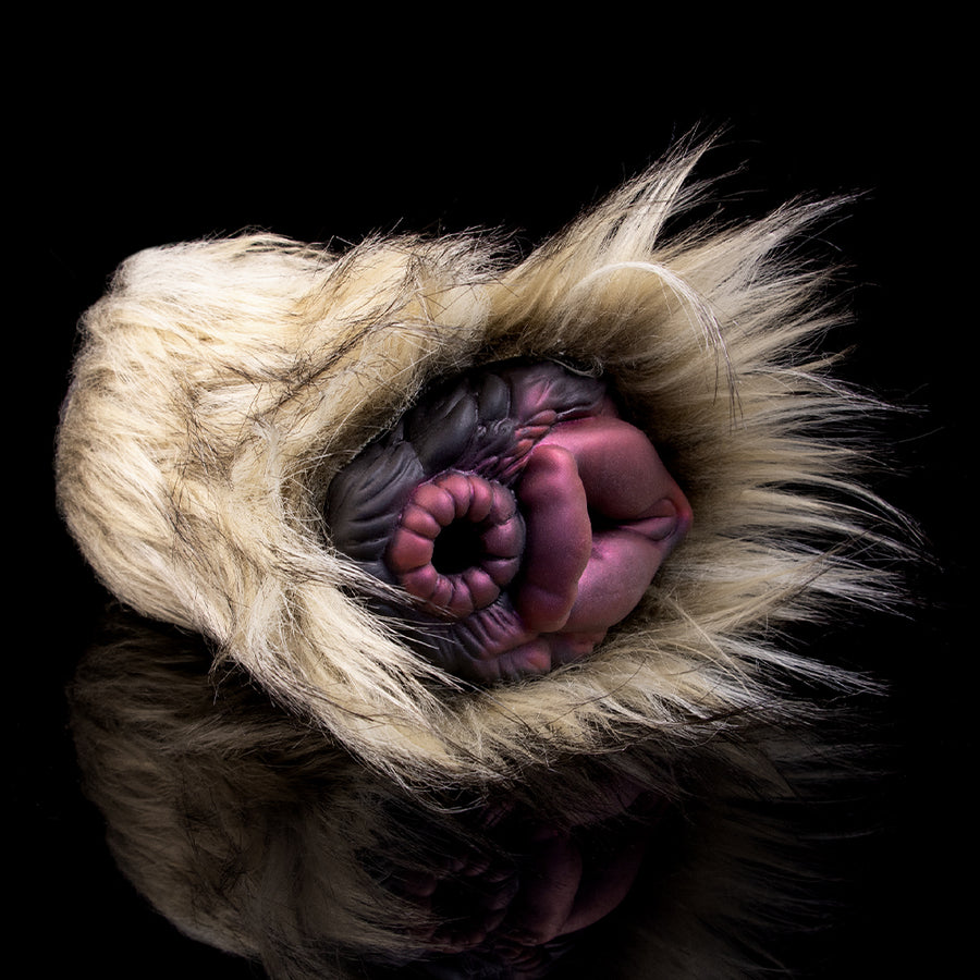 Beige plush furry masturbator with open purple inner cavity and textured edges