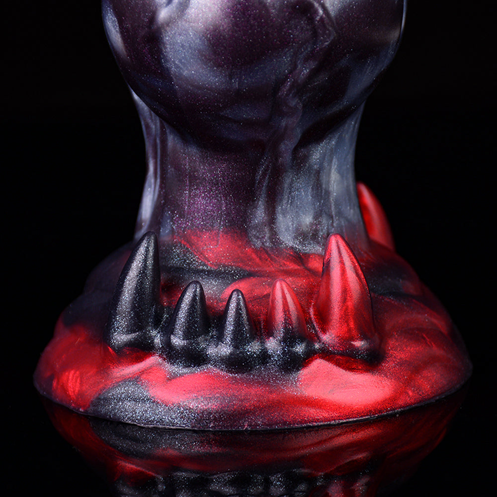 Close-up purple monster knot dildo with red spiked base and glossy texture