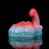 Side view of red-and-blue swirled grinder sex toy with ribbed textured body