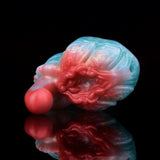 Swirled red-and-blue grinder sex toy viewed from side with rounded red tip