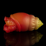 Orange and red squeeze toy crab with yellow tail, side view