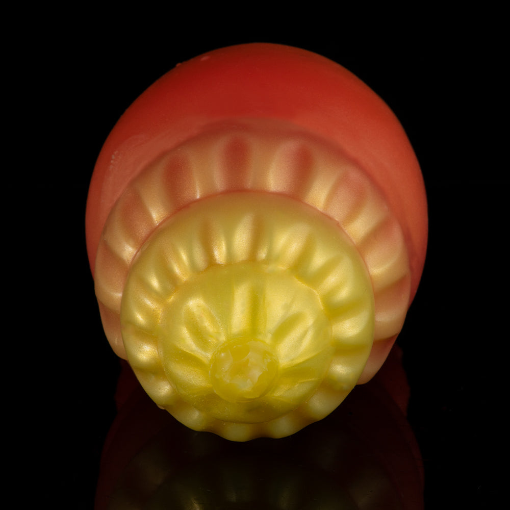 Close-up of orange-and-yellow squeeze toy crab underside