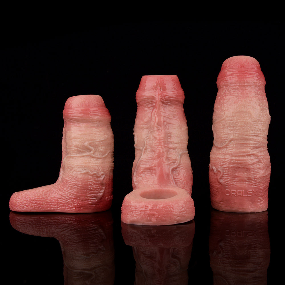 Cyrus extender penis sleeves—three sizes shown on reflective surface, textured pink.