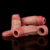 Realistic penis sleeve in pink, textured surface with open ring ends