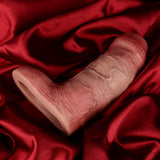 Bent realistic penis sleeve, textured pink, wide opening end; silicone-like surface.