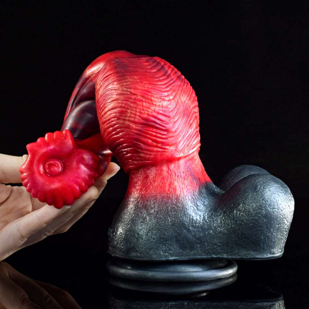 Curved horse dildo with red monster head piece near the dark flared base