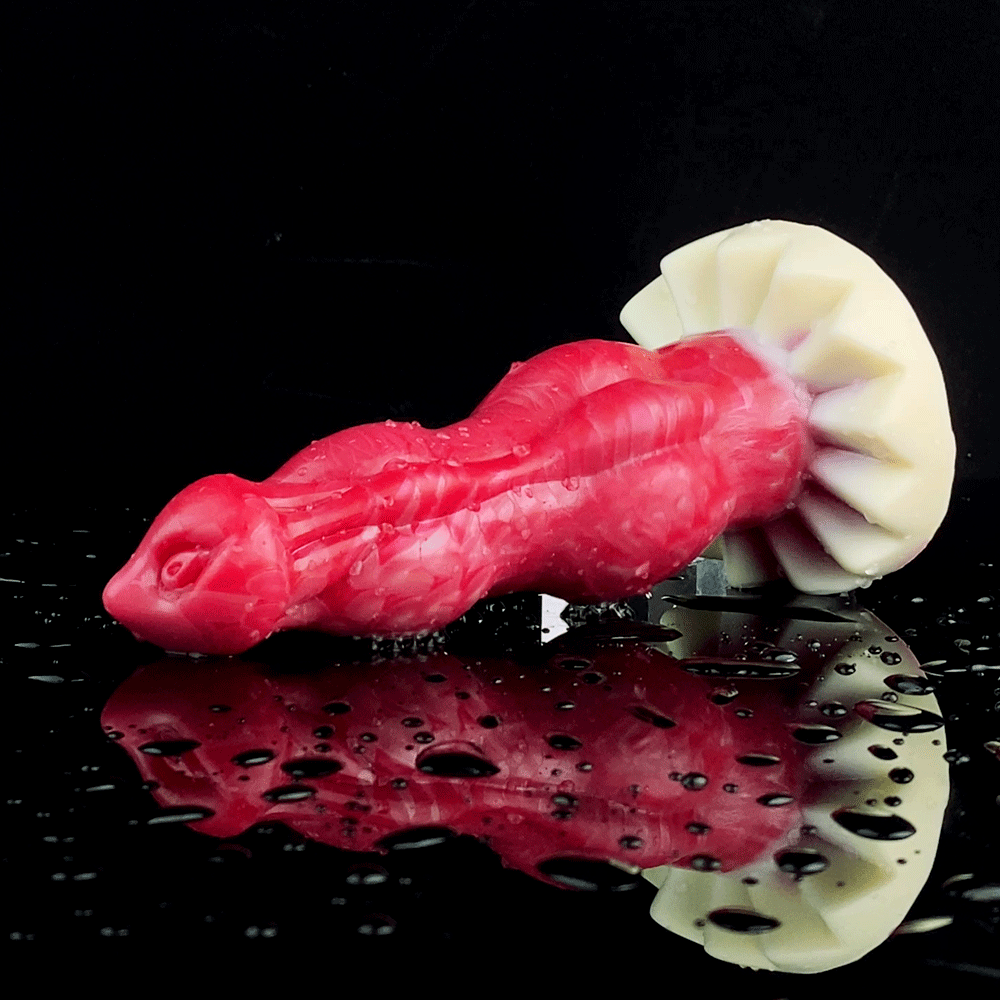 Red Dante double-knot vibrating dildo on display with dual-knot shape and base