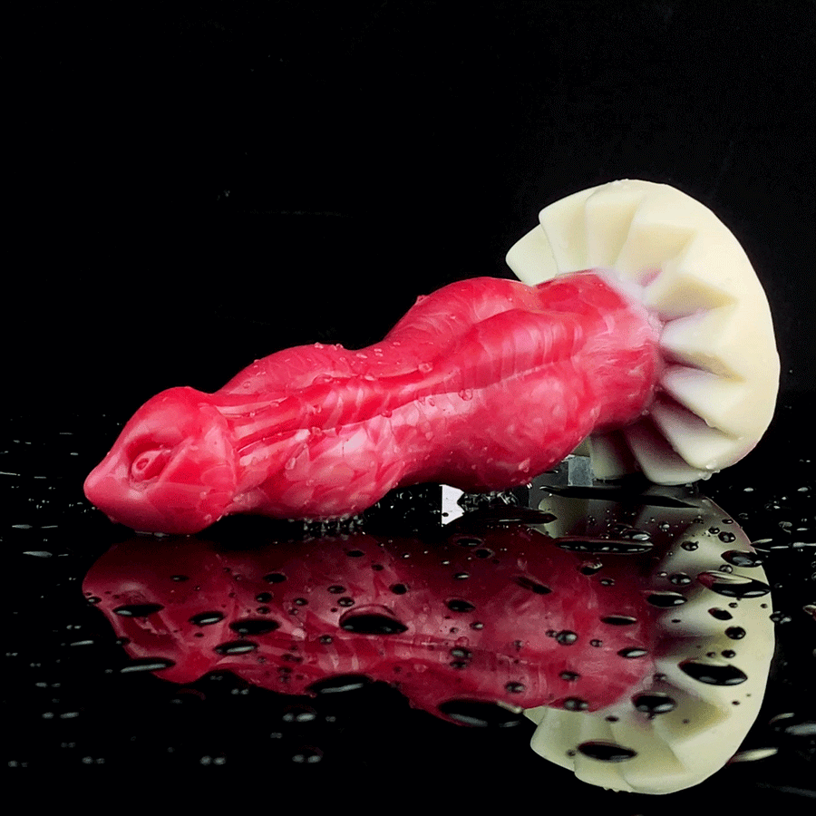 Vibrating double-knot dildo with red marbled body, cream cone heads, water droplets