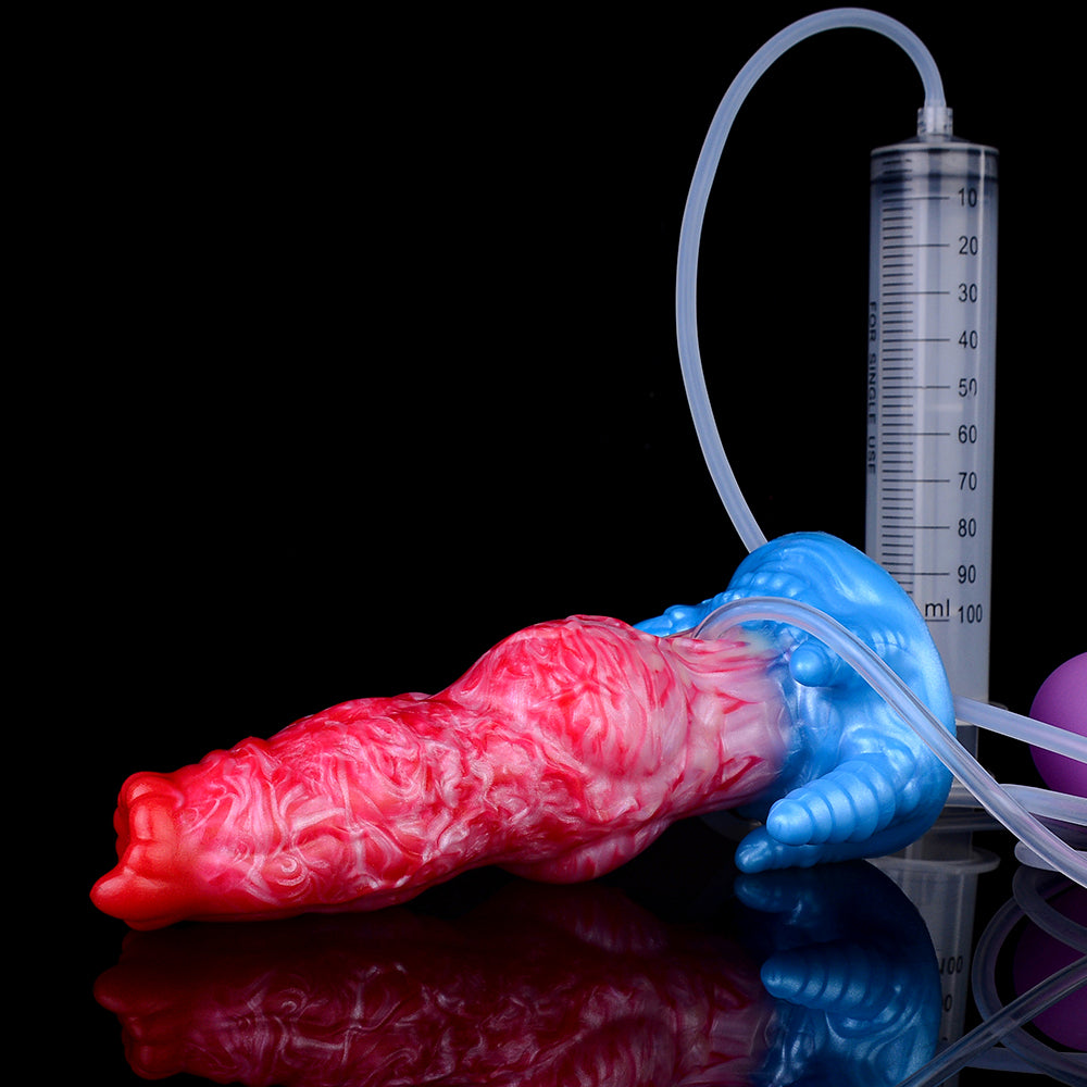 Red-pink inflatable dildo with blue base, clear tubing, and blue pump beside a gauge