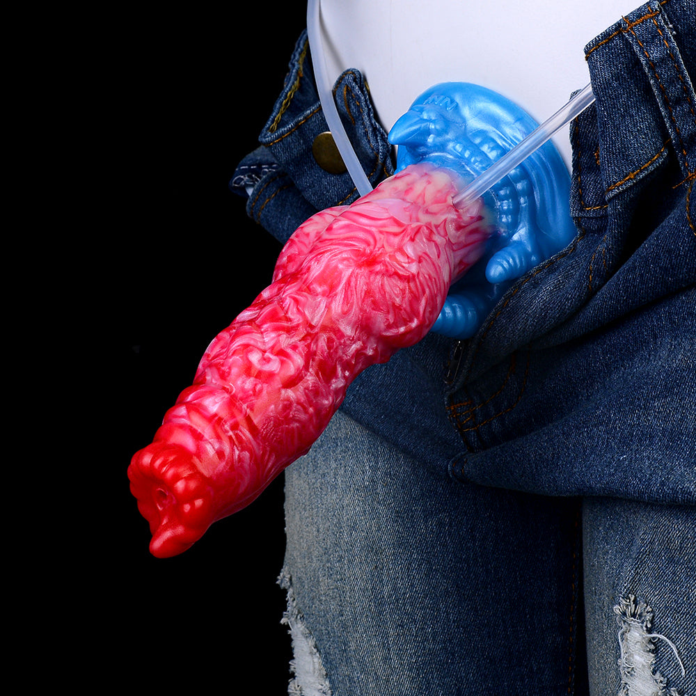 Red-pink inflatable dildo on denim, blue base with clear and blue inflation tubes