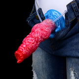 Red-pink inflatable dildo on denim, blue base with clear and blue inflation tubes