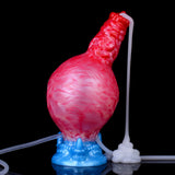 Red-pink inflatable dildo with blue base, clear tube and white valve end