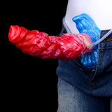 Inflatable dog dildo in denim pants, red-pink swirled body with blue base