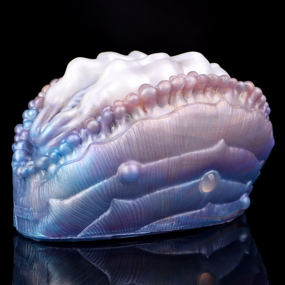 Deep Sea Clam shell close-up, ridged blue and purple with beaded rim