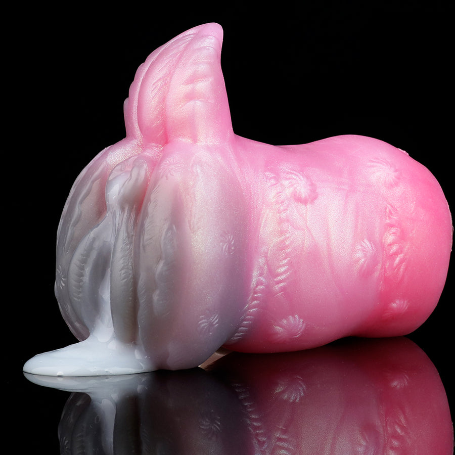 Pink and translucent deer-shaped sex toy, side view with raised antler-like head