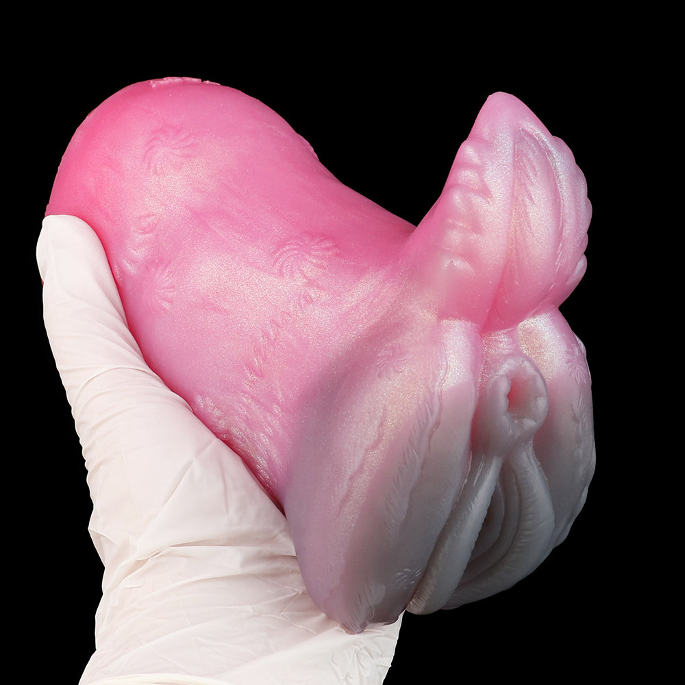 Pink deer-themed sex toy with sculpted textures and antler-like head detail