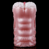 Dragon stroker back view, sculpted scale pattern on pink textured sleeve.