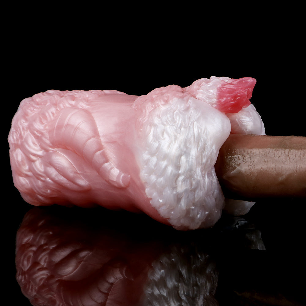 Dragon stroker, glossy pink shaft with raised scales and ribbed ridge.