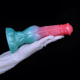 Alien werewolf style dildo with teal head, pink tail, textured sculpting
