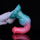 Alien werewolf dildo C-shaped view, teal head and pink shaft, gloved hands