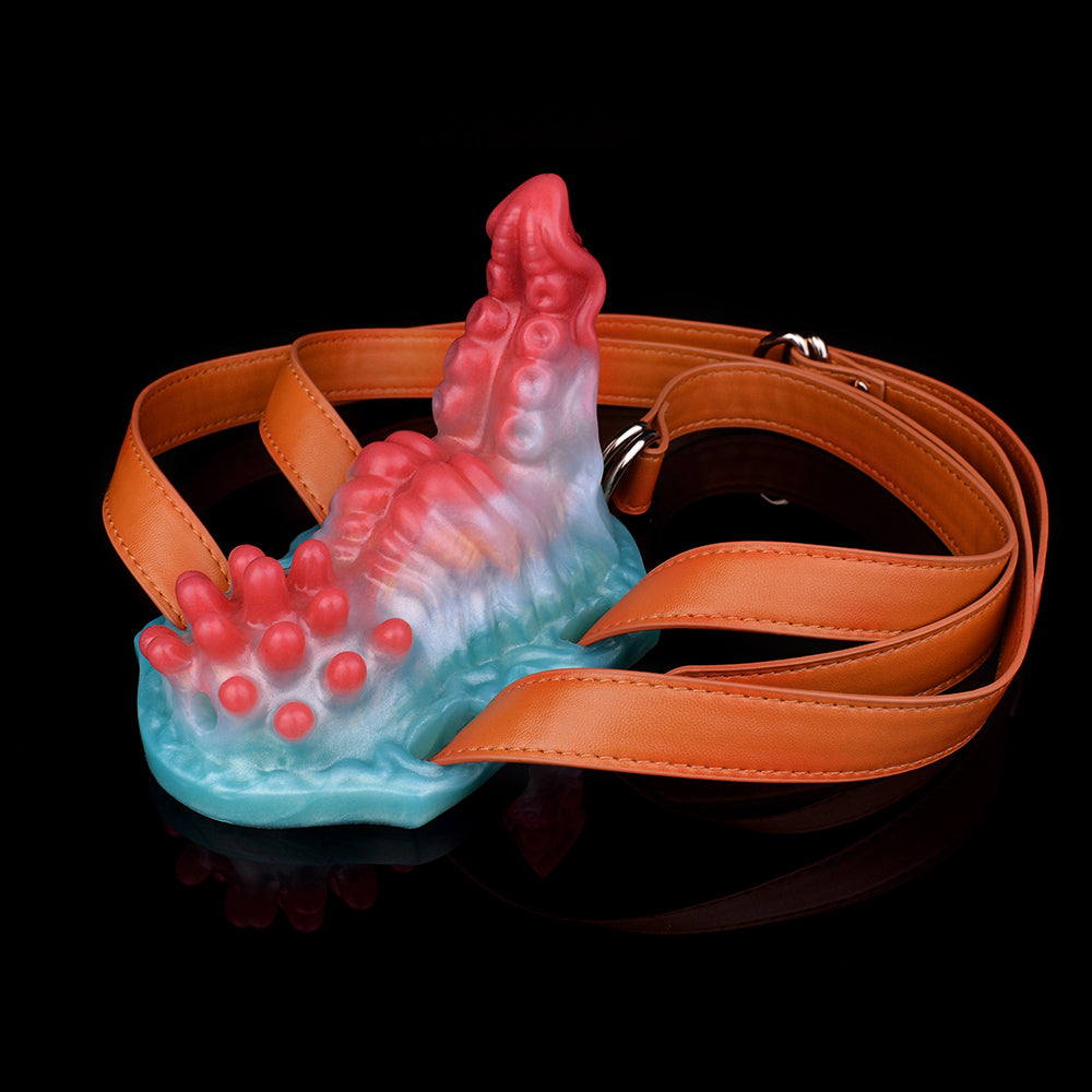 DirtyToyz strap-on grinder toy with orange straps, red-blue bumpy texture