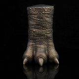 Bronze textured clawed hand with three finger points and thick knuckles