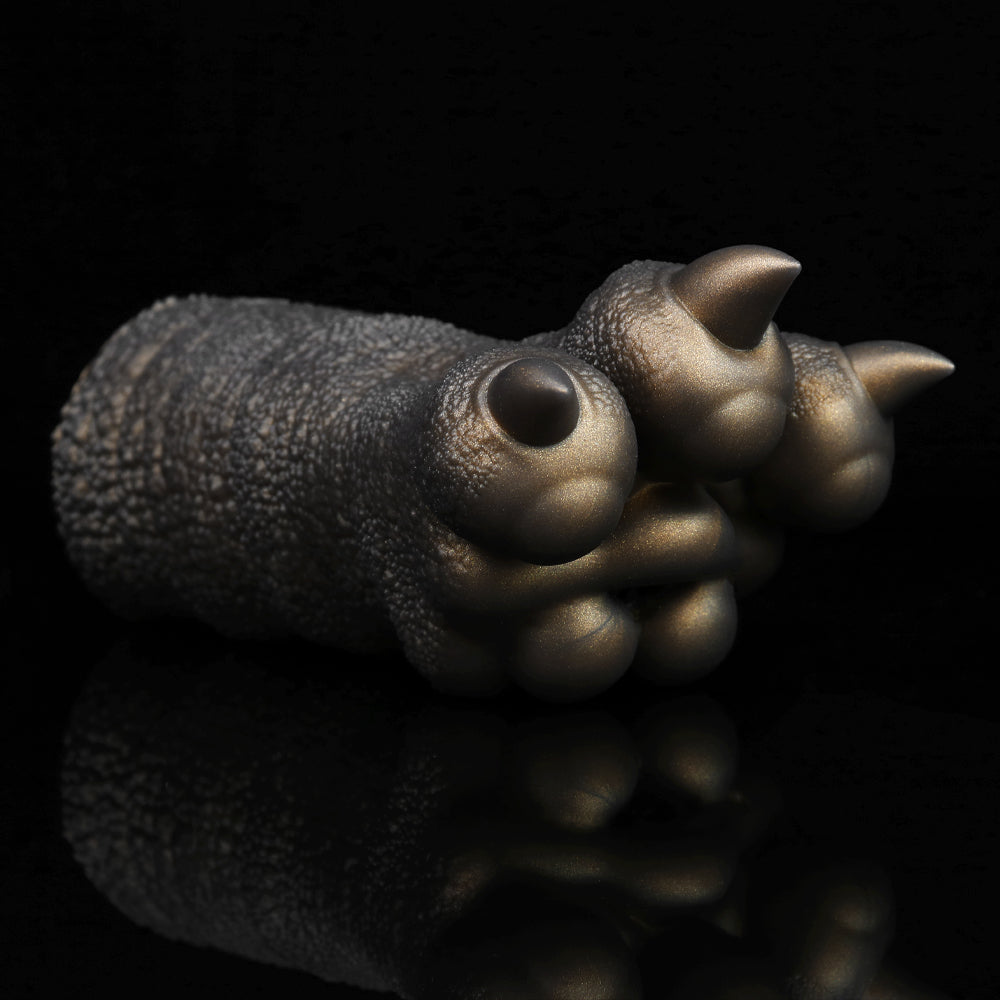 Bronze textured clawed hand curled, two visible spike tips and rounded knuckles