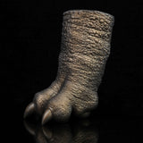Bronze textured clawed hand posed forward with pointed finger tips