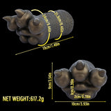 Bronze-colored textured hand figurine holding a clear glass bottle with size diagram