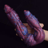 Alien Dildo von der Seite: zwei Köpfe, lila-blau gemustet, flexibler Mittelbereich.