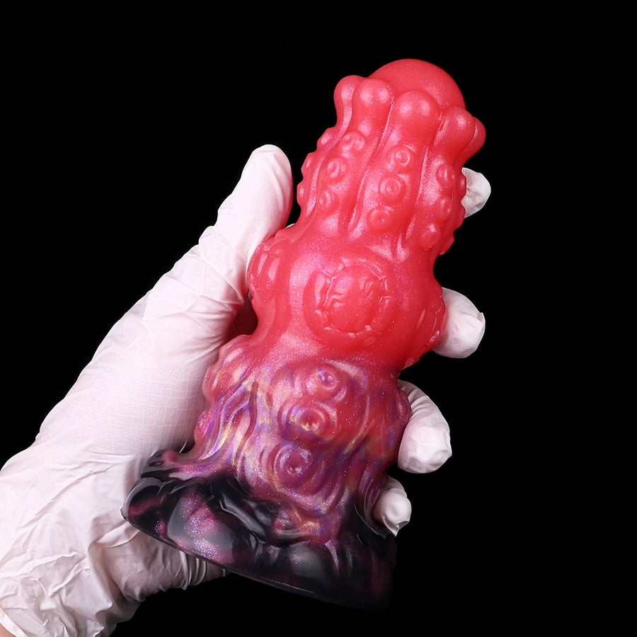 Fantasy anal dildo with red, purple swirl details and ribbed texture, front angle