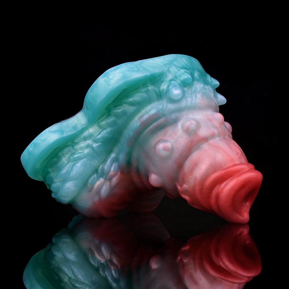 Vibrating grinder sex toy close-up, blue and pink translucent swirl