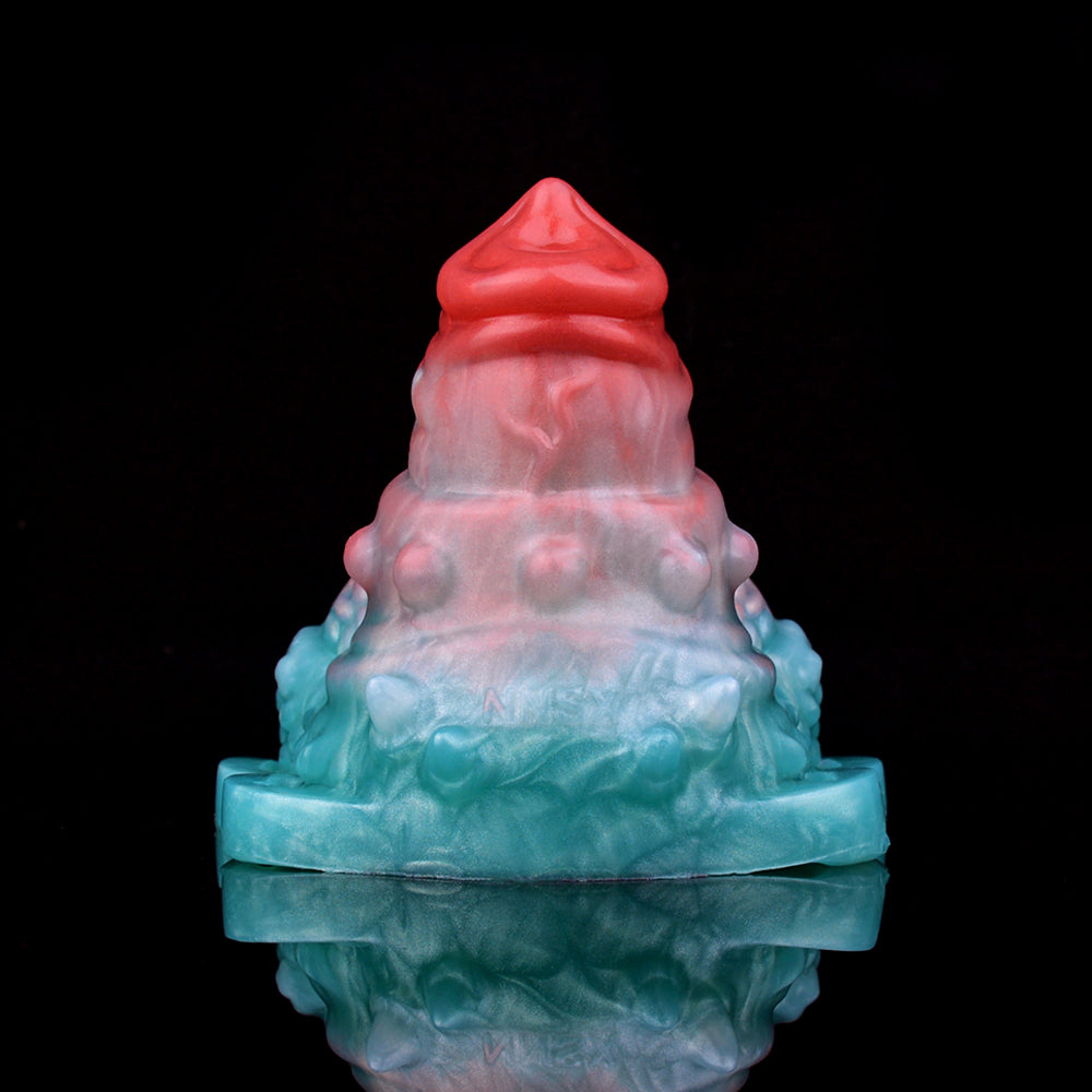 Top view vibrating grinder sex toy, red tip and blue translucent base