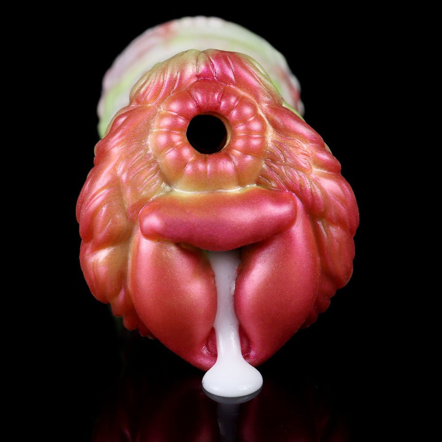 Two-hole fantasy monster stroker with pink ridged head and open center hole