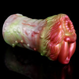 Elyraze monster stroker side view: glossy pink-red and pale green ridged body, two openings