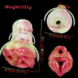 Elyraze monster stroker: angled views of glossy pink-red two-hole face and ridged body