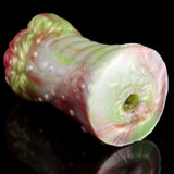 Elyraze monster stroker end view: pale green circular opening on glossy translucent body