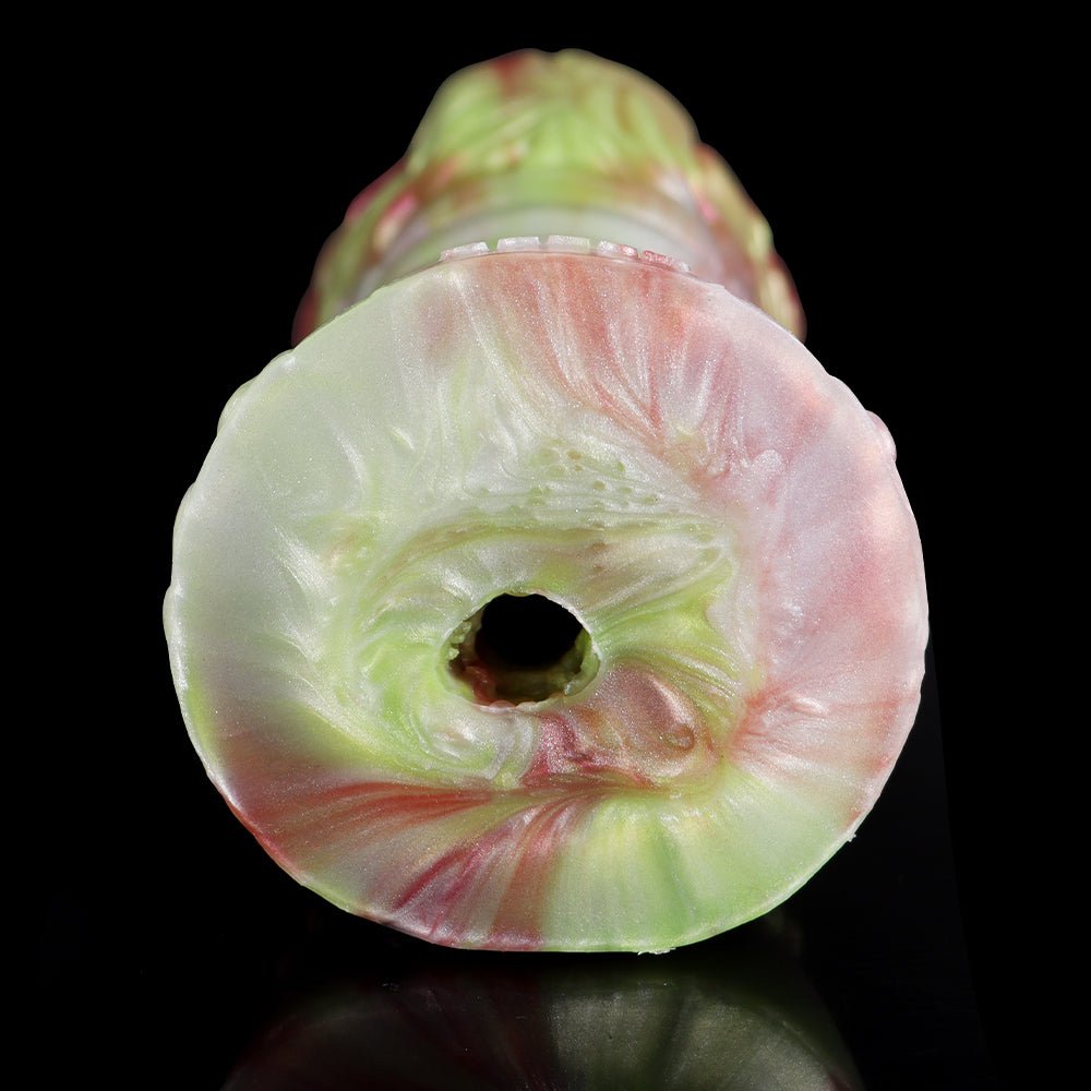 Elyraze monster stroker: circular opening on pale green face with glossy pink highlights
