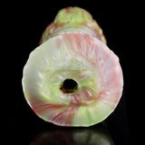Elyraze monster stroker: circular opening on pale green face with glossy pink highlights