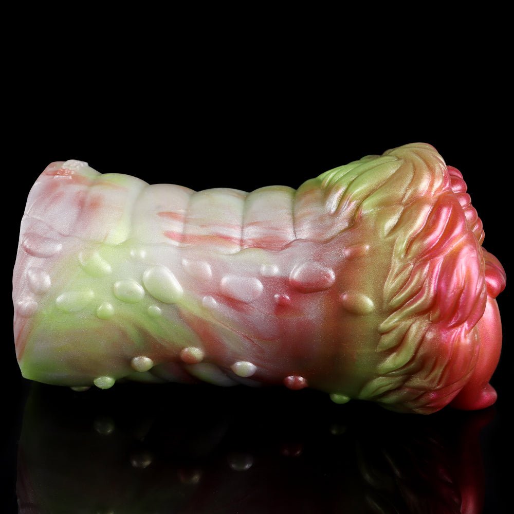 Elyraze monster stroker: textured glossy pale green and pink ridged body, angled side