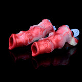 Two red-and-white knot sheath extenders, open ends facing left and right