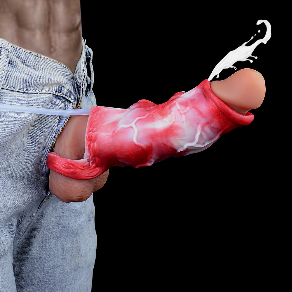 Red-and-white knot sheath extender held in hand, open nozzle tip visible