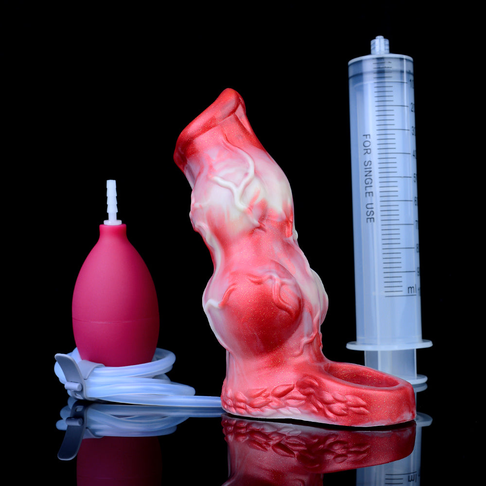 Red/white knot sheath extender beside syringe and measuring tube