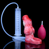 Red silicone cock sleeve with open base shown with measuring syringe and bulb
